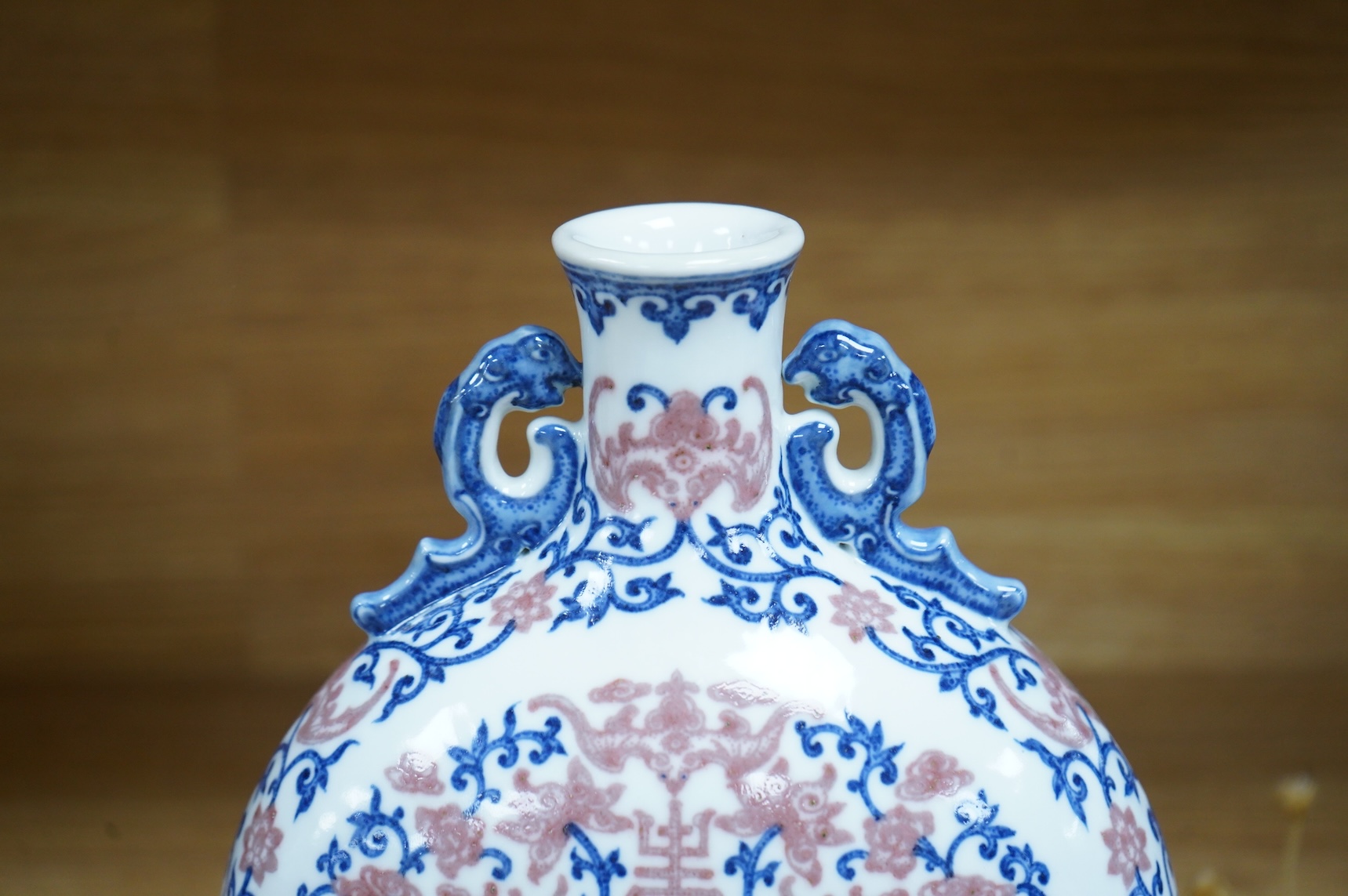 A 20th century Chinese underglaze blue and copper red moonflask, seal mark to base, 26.5cm
